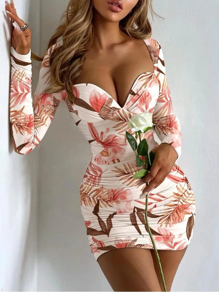 “Low-Cut Printed Bodycon Mini Dress – Club-Ready, Curve-Hugging & Bold”